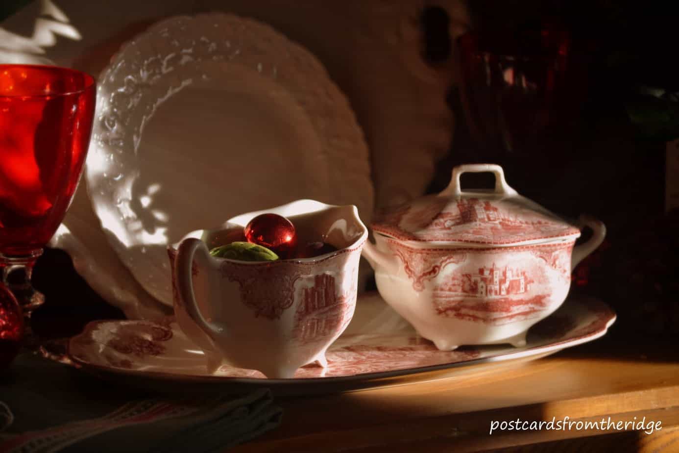 Red transferware, white ironstone, and green glasses