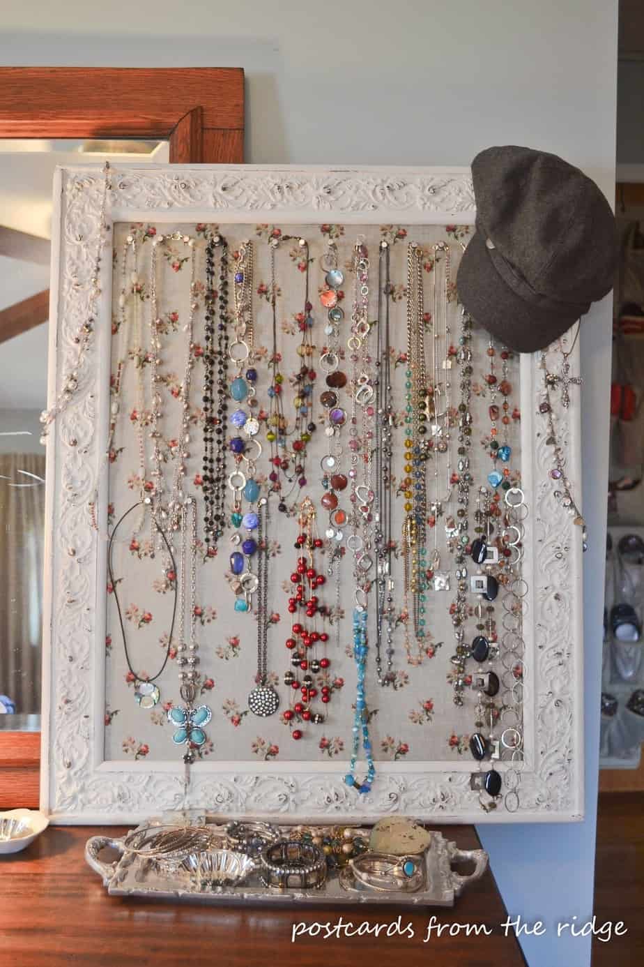 An old beat up frame turned into a jewelry board, plus other great ideas for jewelry organization.