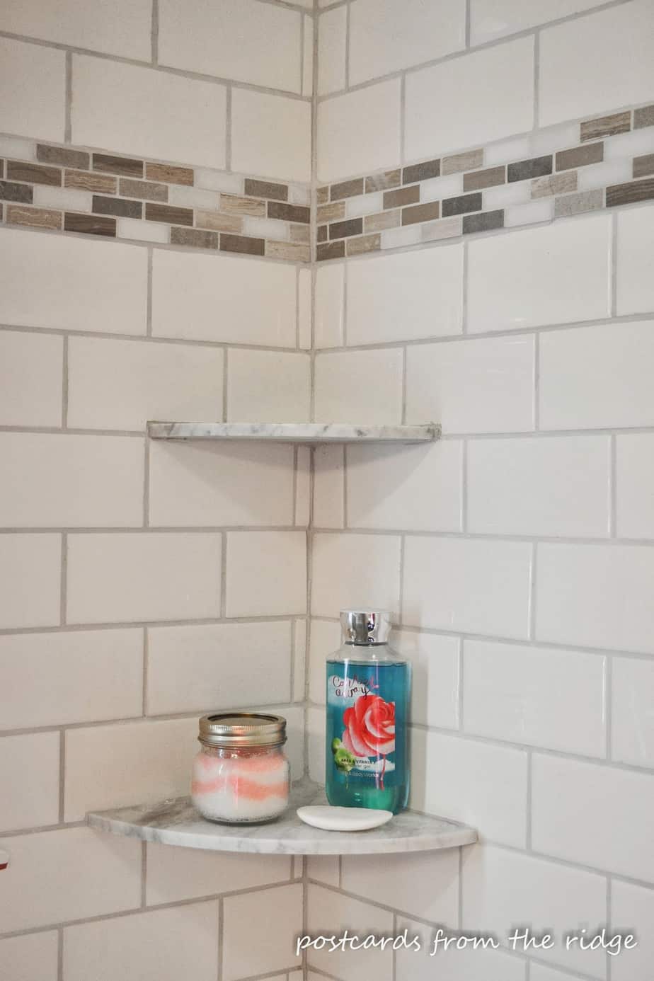 Great idea for a place for shampoo and soap in the shower.  Lots of other great bathroom ideas here.