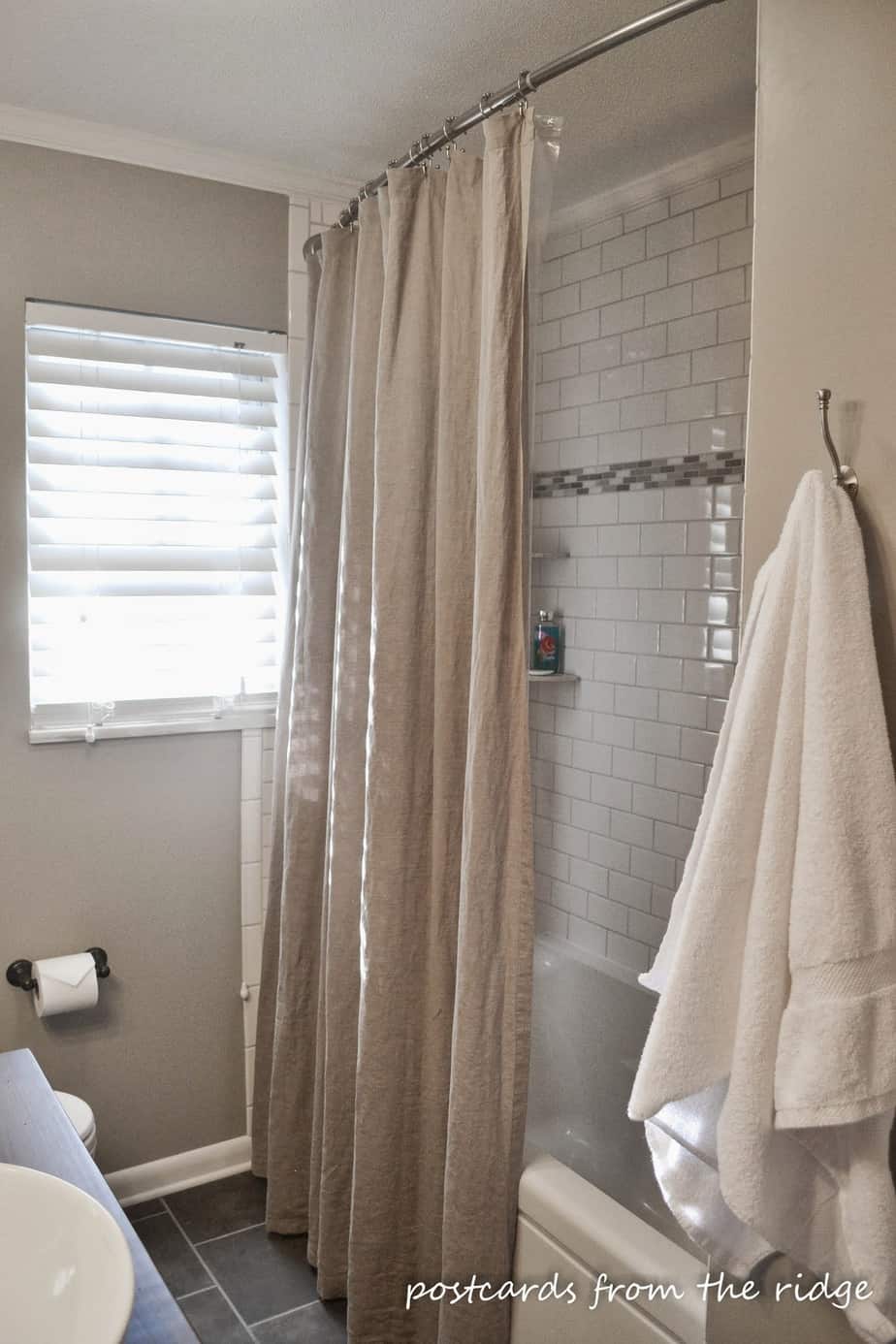 I love the extra long shower curtain and the curved shower curtain rod.  Lots of great ideas for the bathroom here.