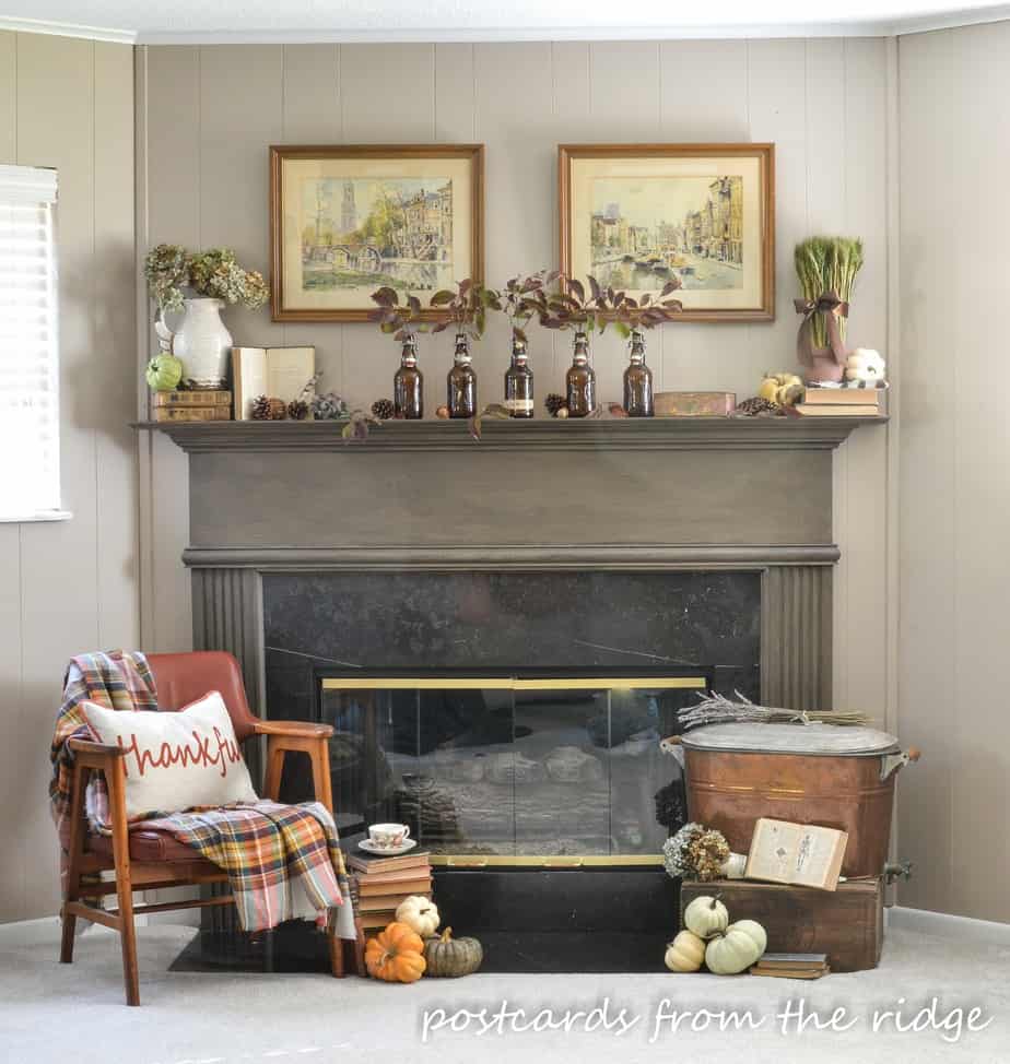 brown painted mantel with fall decor