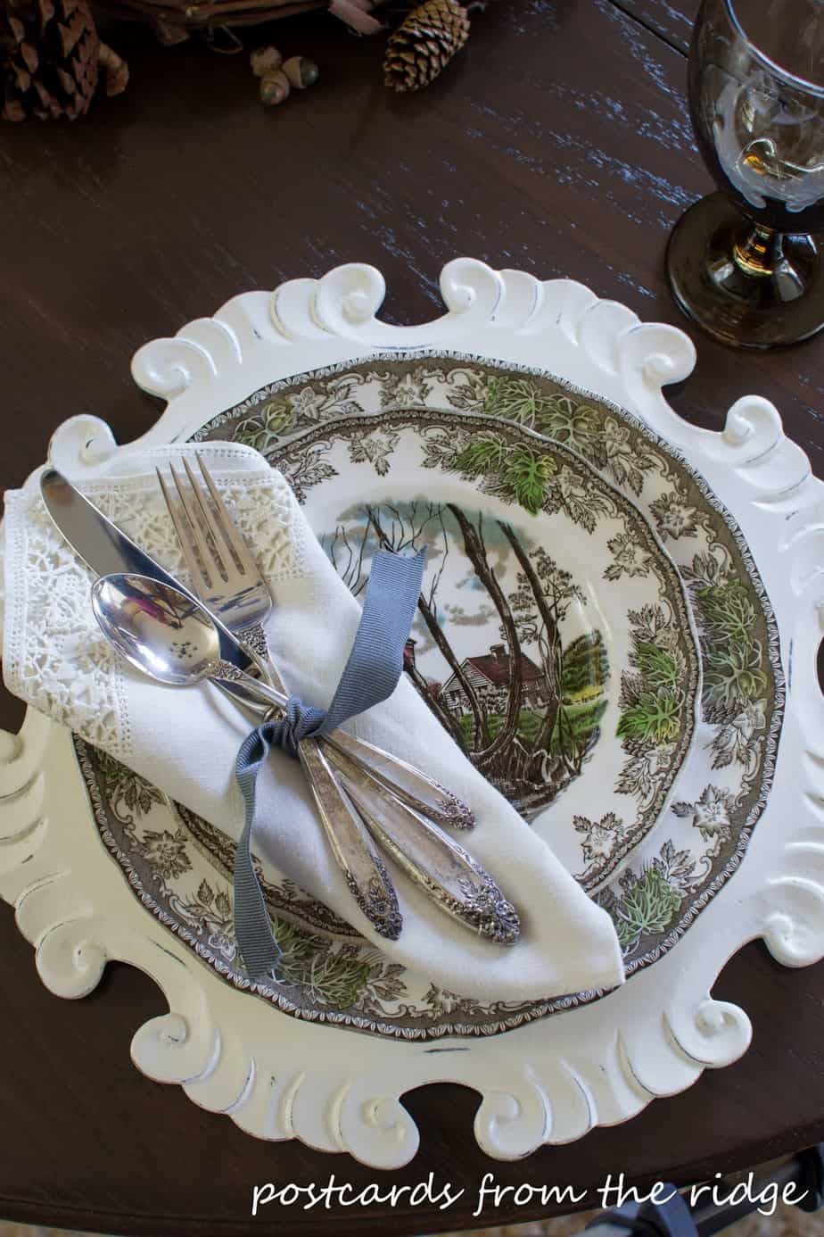Vintage silverware and linens paired with brown transferware.