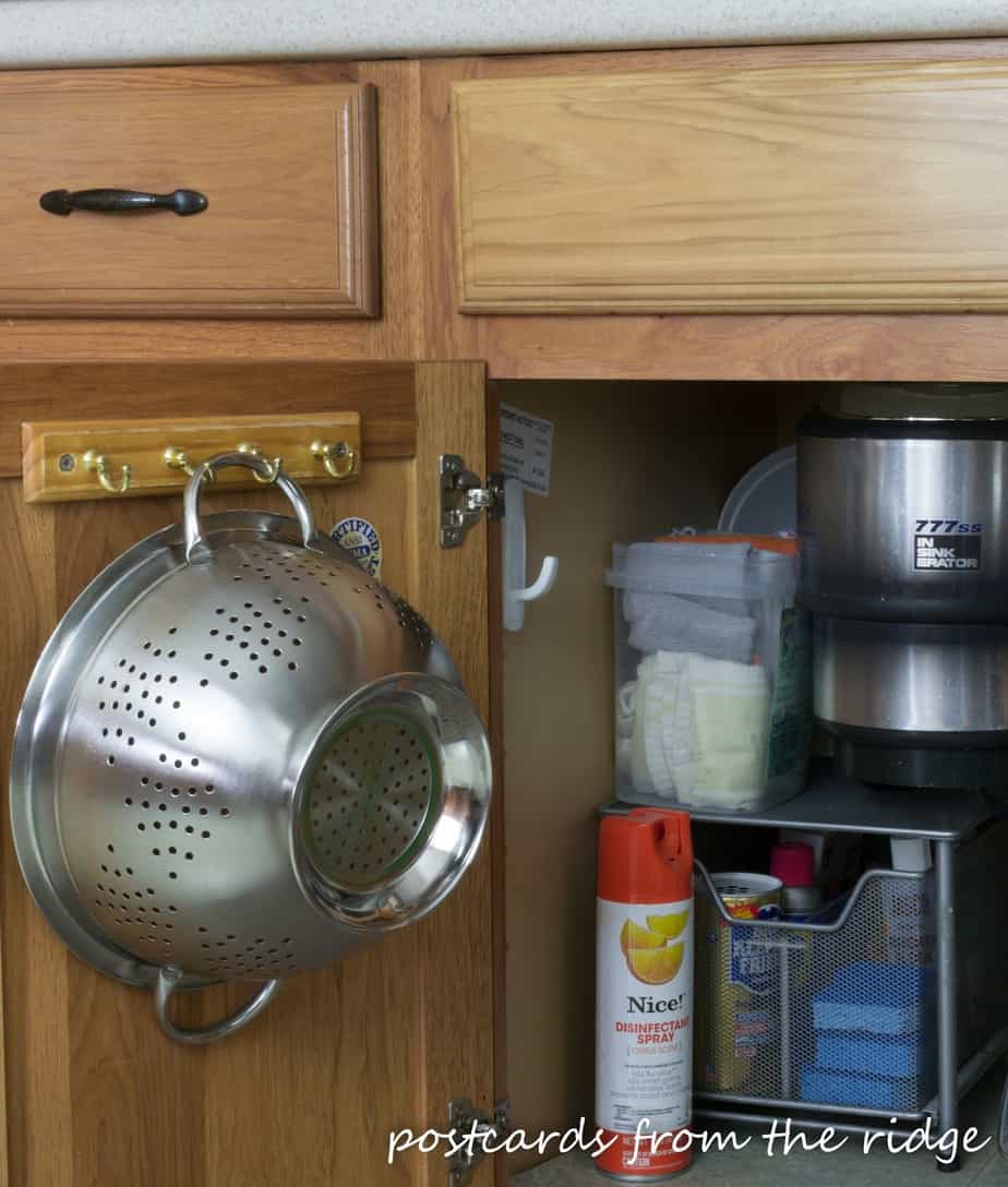Colander under the sink. Great idea! Tons of other ideas on this site.