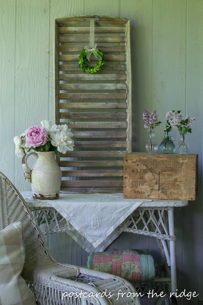 vintage linen on old white wicker table