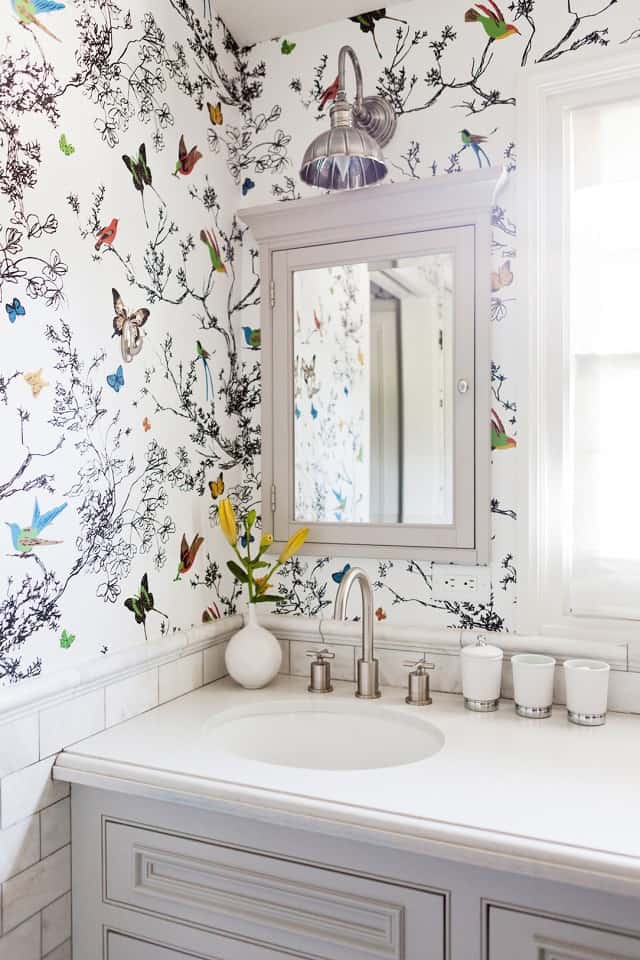 bathroom with bird wallpaper design