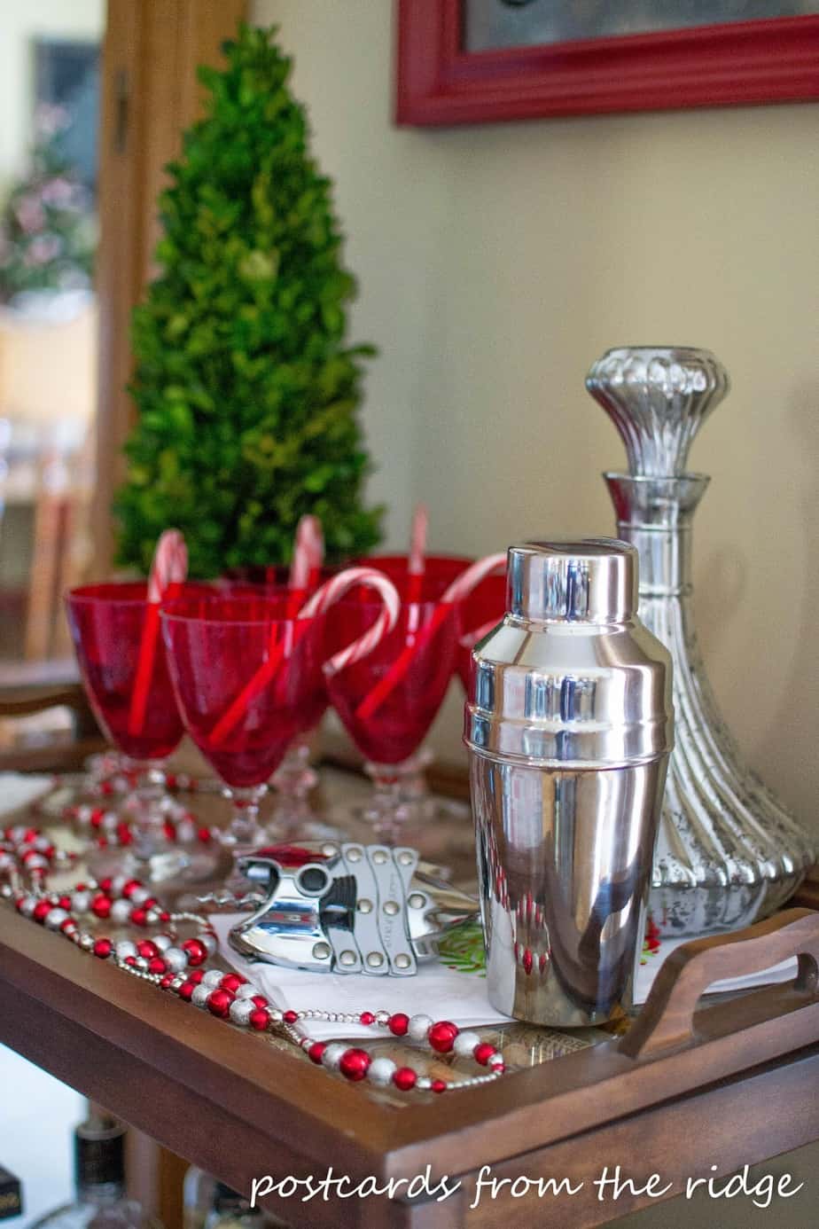 Love this holiday bar cart. Lots of other great Christmas decorating ideas on this site.