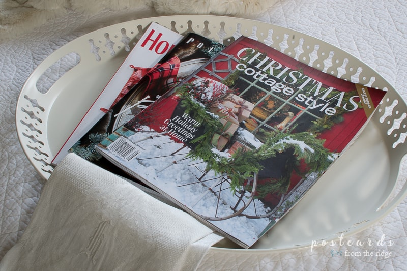 Christmas magazines on a pretty tray. Lots of other Christmas decorating ideas on this site.