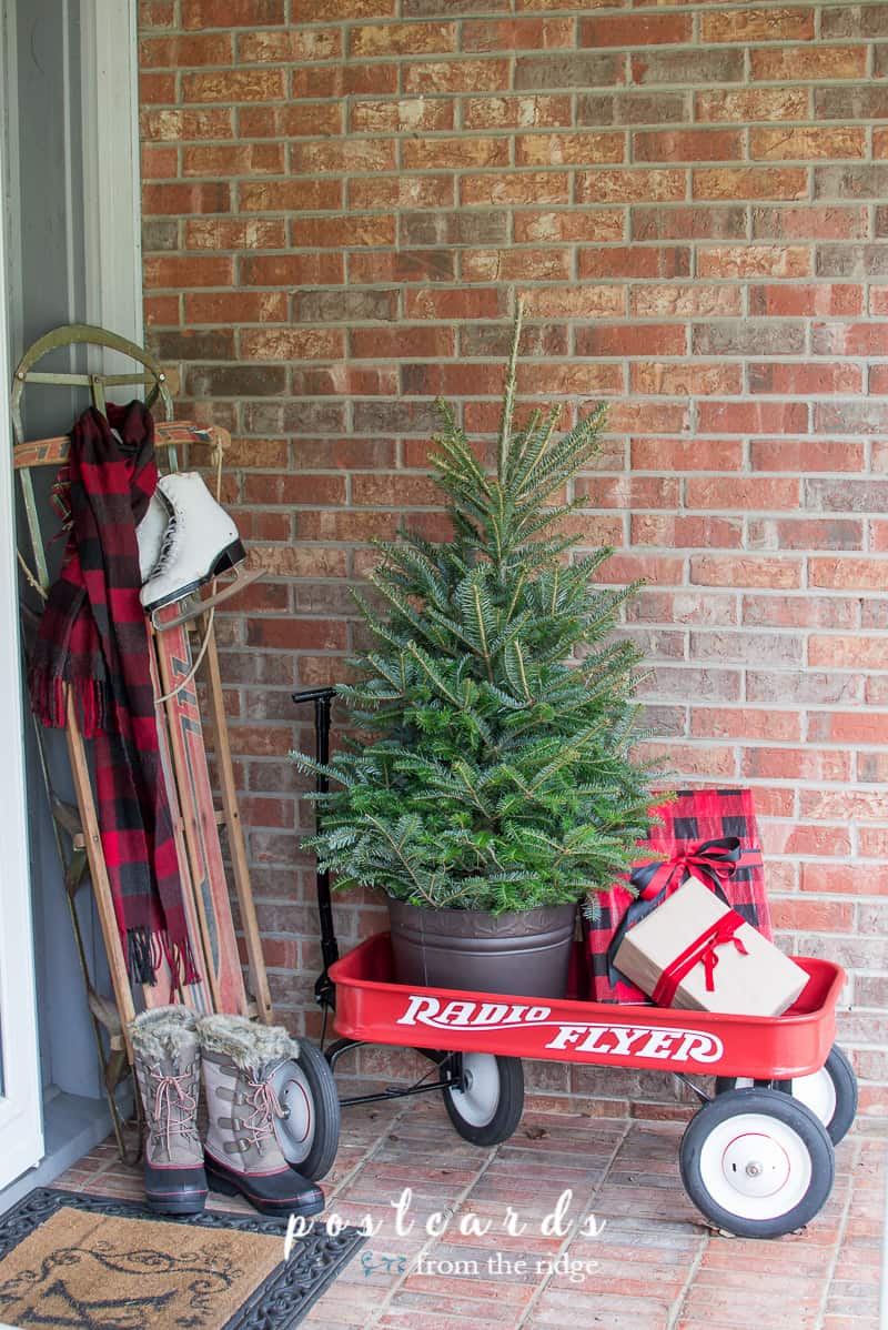 Love this cozy Christmas porch. Lots of great Christmas decorating ideas on this site.