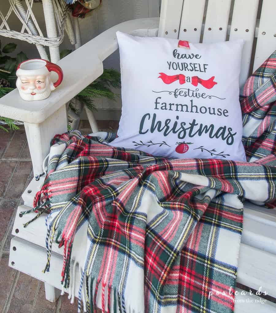 plaid throw blanket with farmhouse Christmas pillow cover and Santa mug