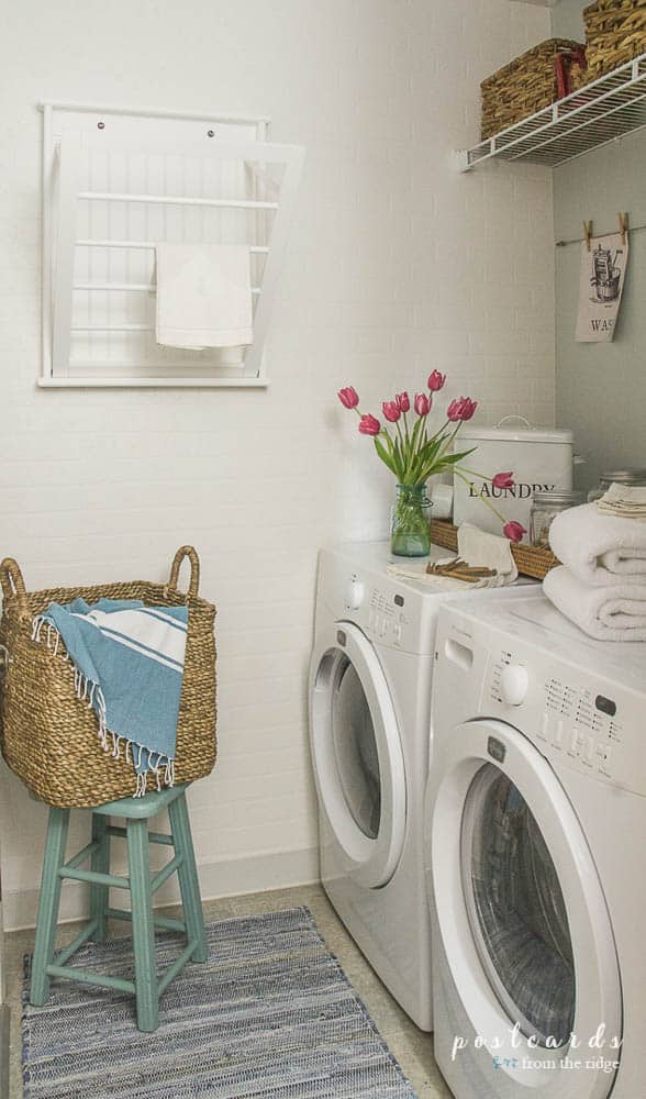 small laundry room makeover with white brick wallpaper