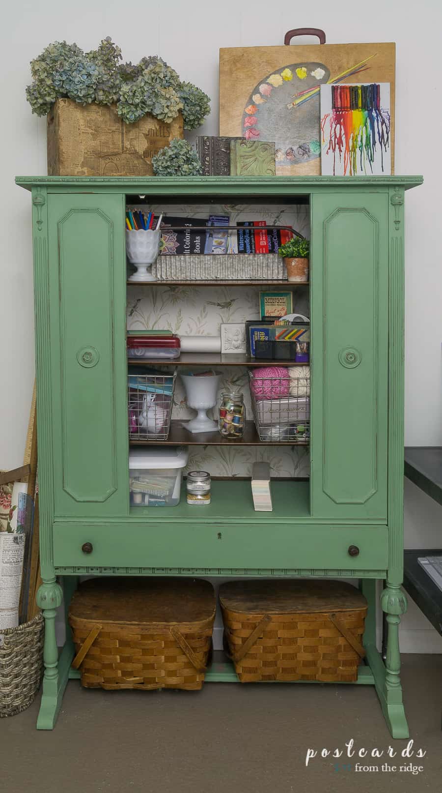 green paint and bird wallpaper on a vintage China cabinet