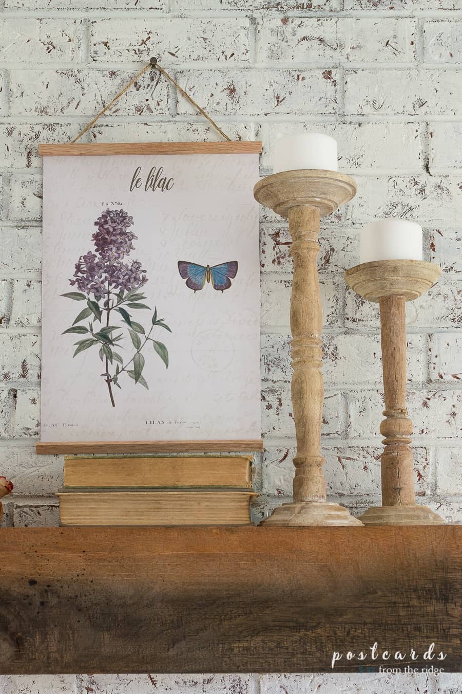 vintage book, found wooden candlesticks, and lilac botanical prints