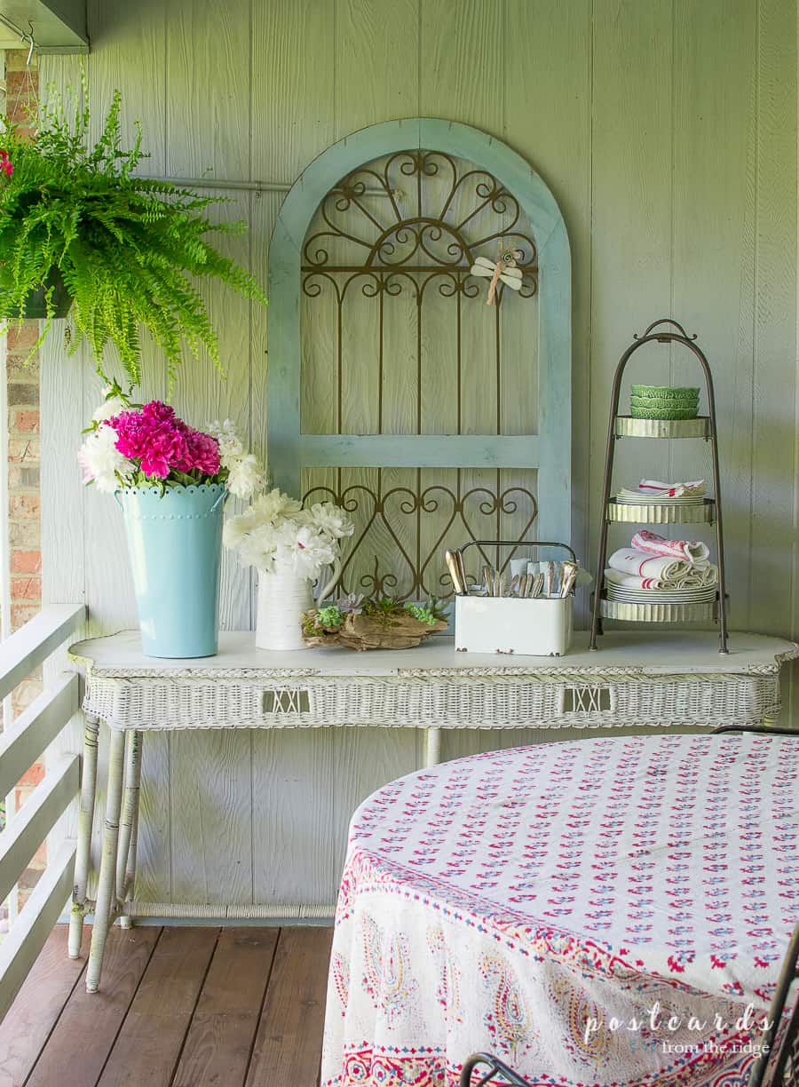 white wicker table with outdoor summer decor