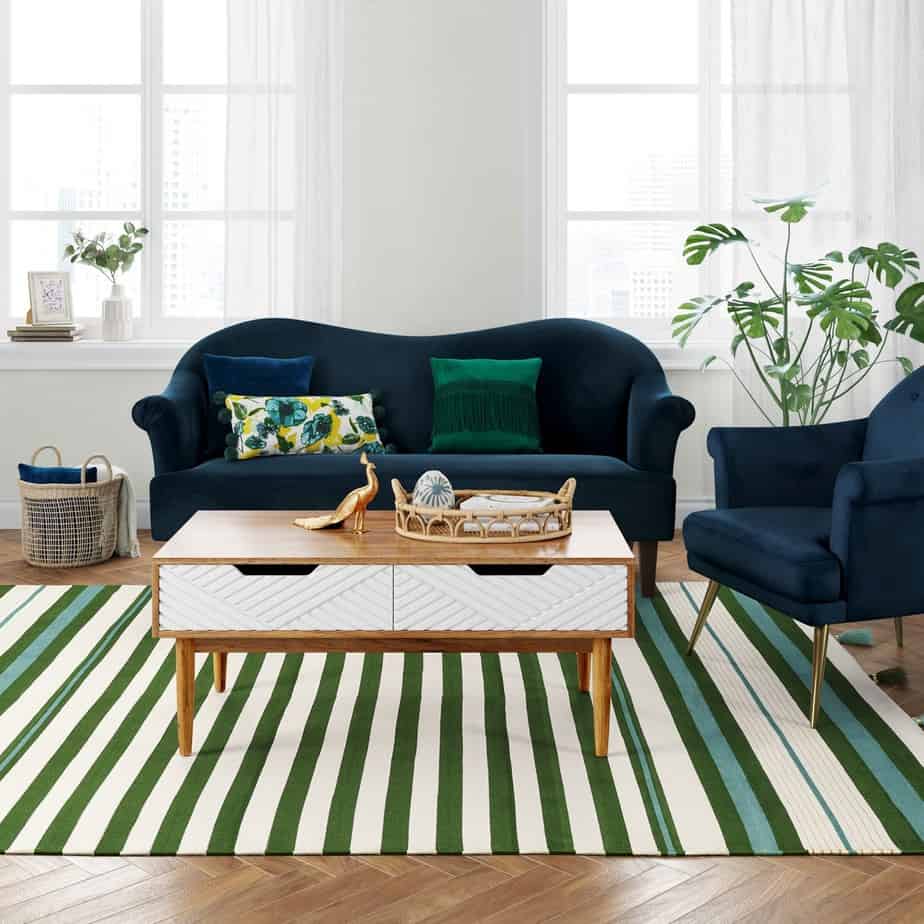 green stripe area rug with blue sofa and chair