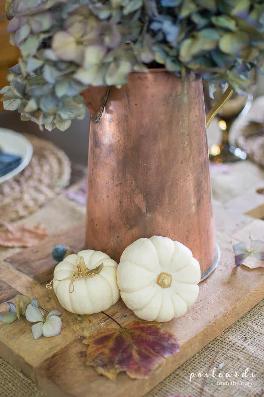 copper pitcher and baby boo pumpkins