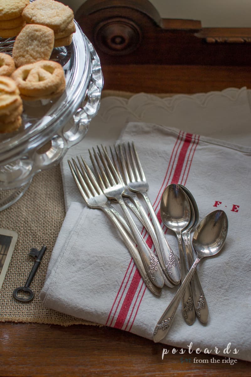 red and white striped vintage kitchen towel with vintage silverware