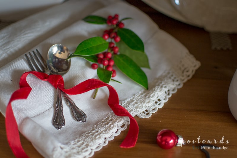 old baby silverware and red velvet ribbon