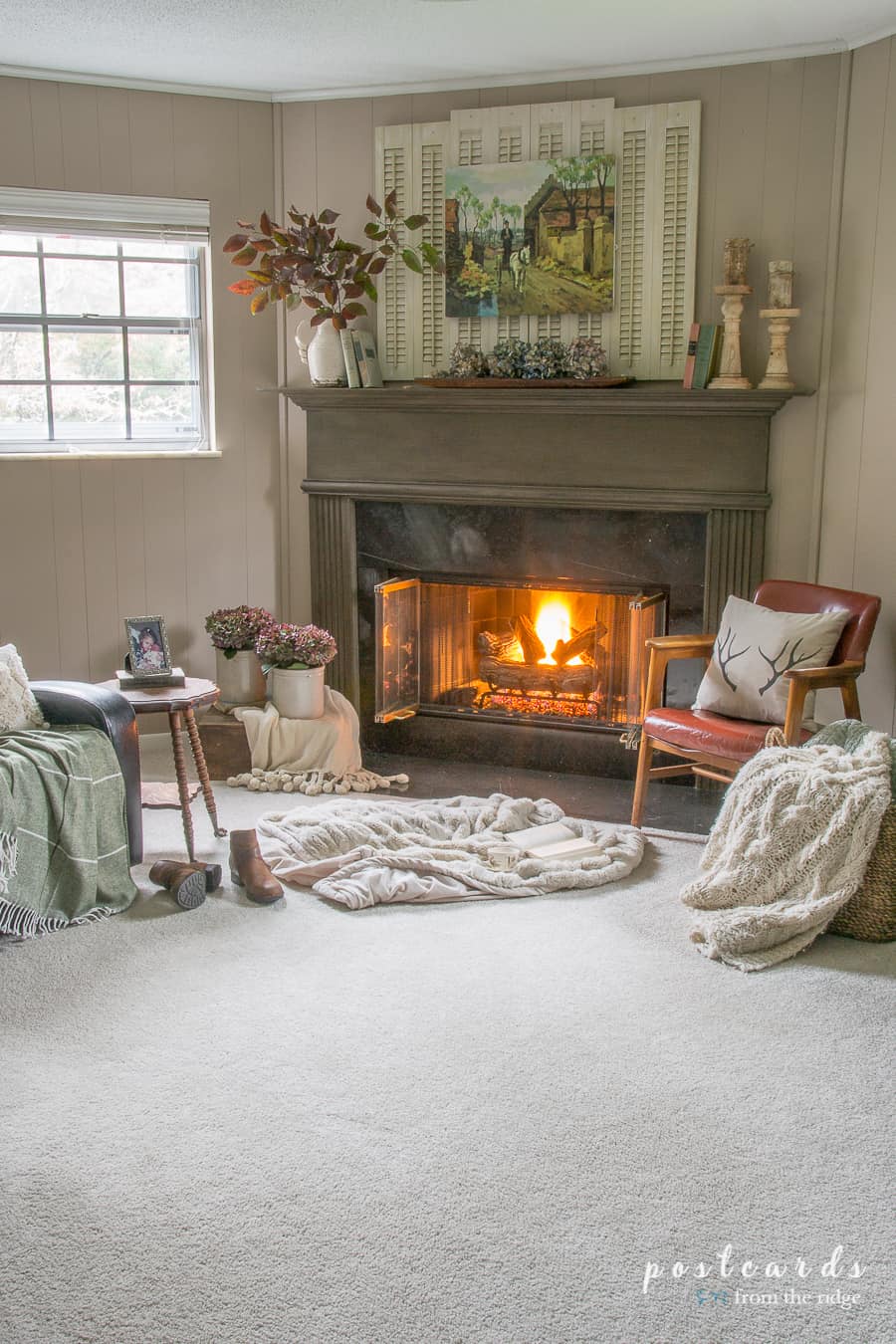 cozy room with fireplace and carpet
