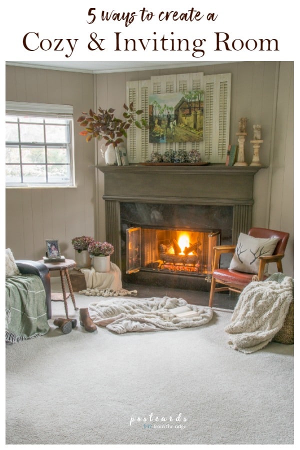cozy carpeted room with fire in the fireplace