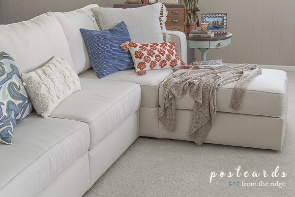 Cozy family room with Lovesac sactional and comfy pillows. #lovesac #sectional #whitesofa #familyroom