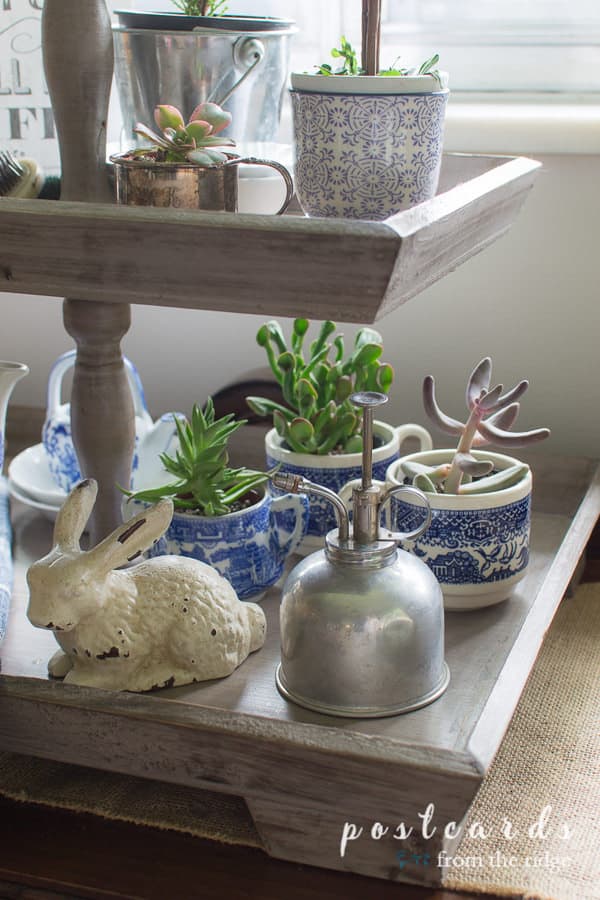 blue and white decor on a wooden 2 tiered tray