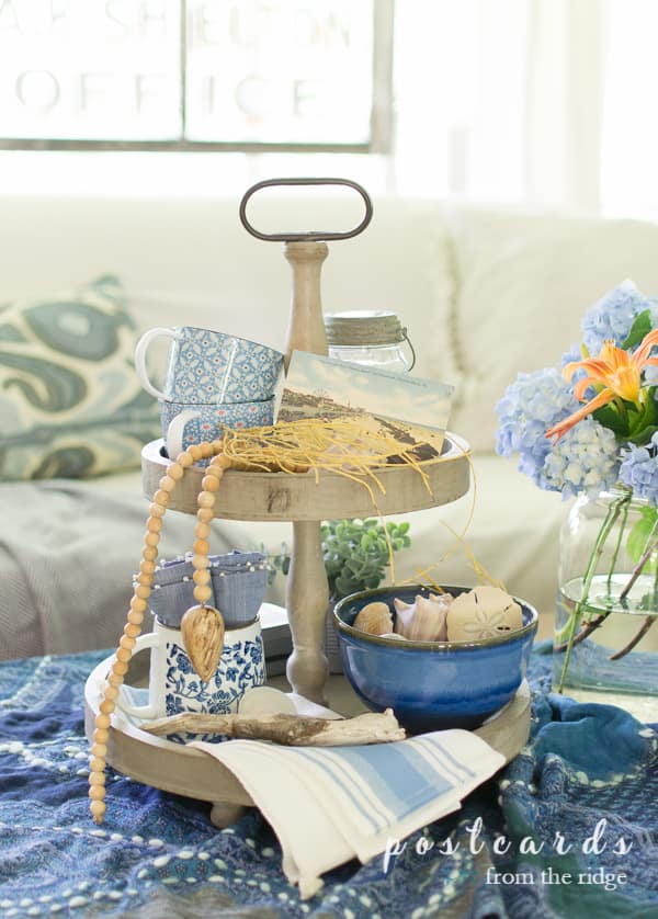 2 tiered wooden tray with blue coastal decor