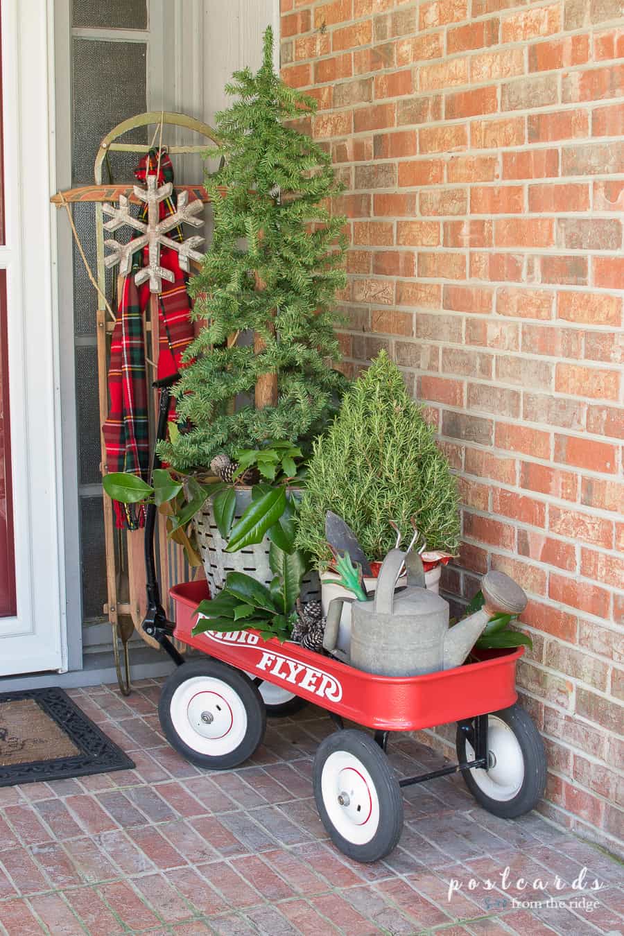 red wagon with old sled and Christmas decor