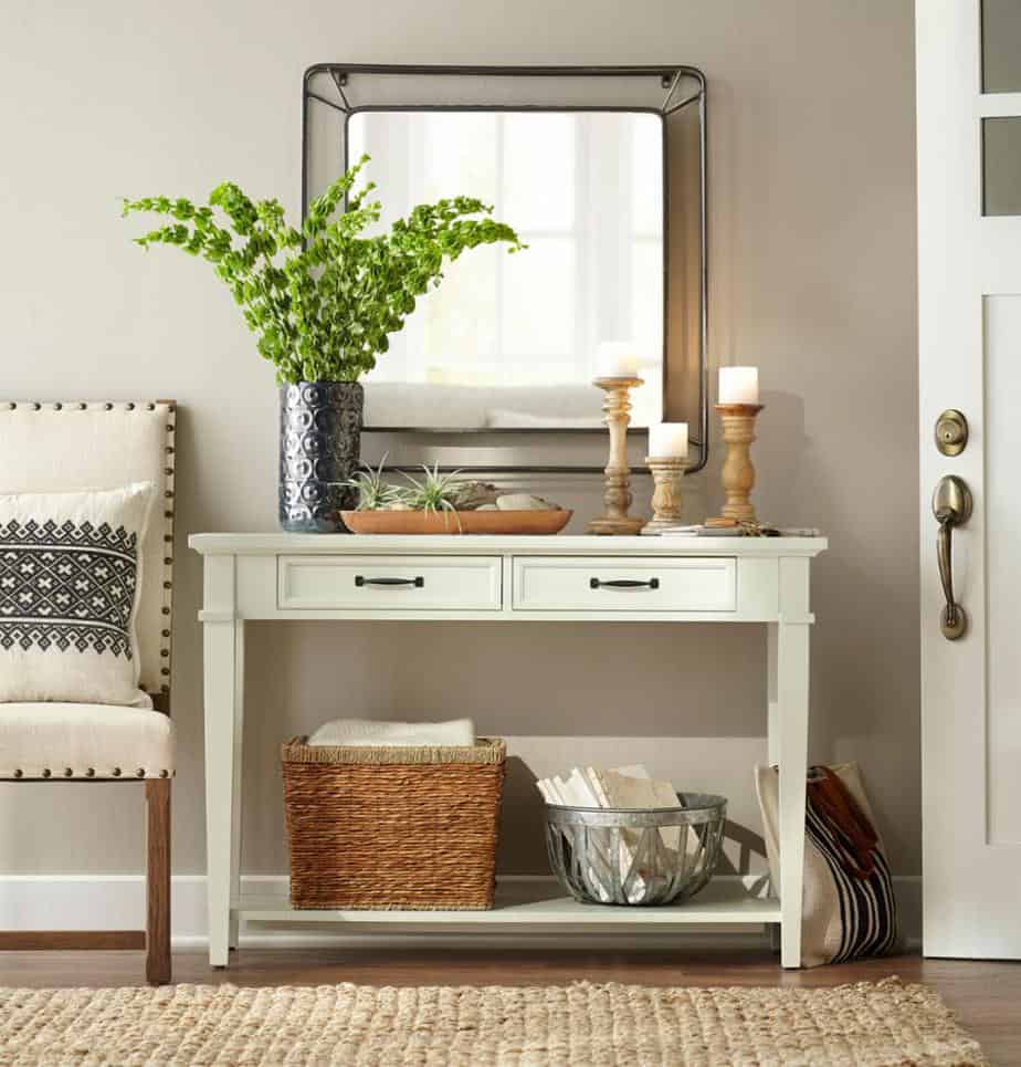 entry decorated with white table, chair, natural rug, and more from The Home Depot