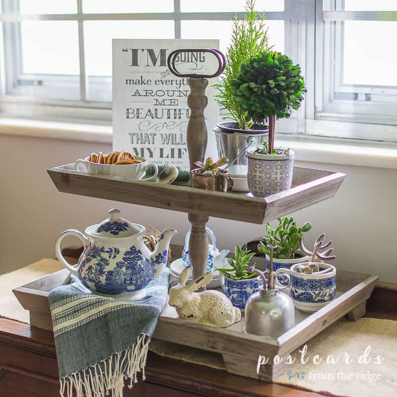 blue and white decor in a wood tiered tray