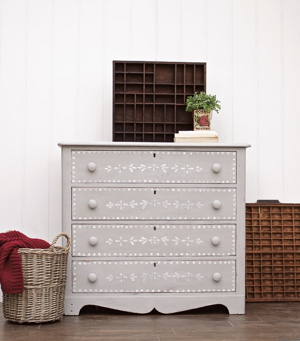 gray dresser with stenciled drawers