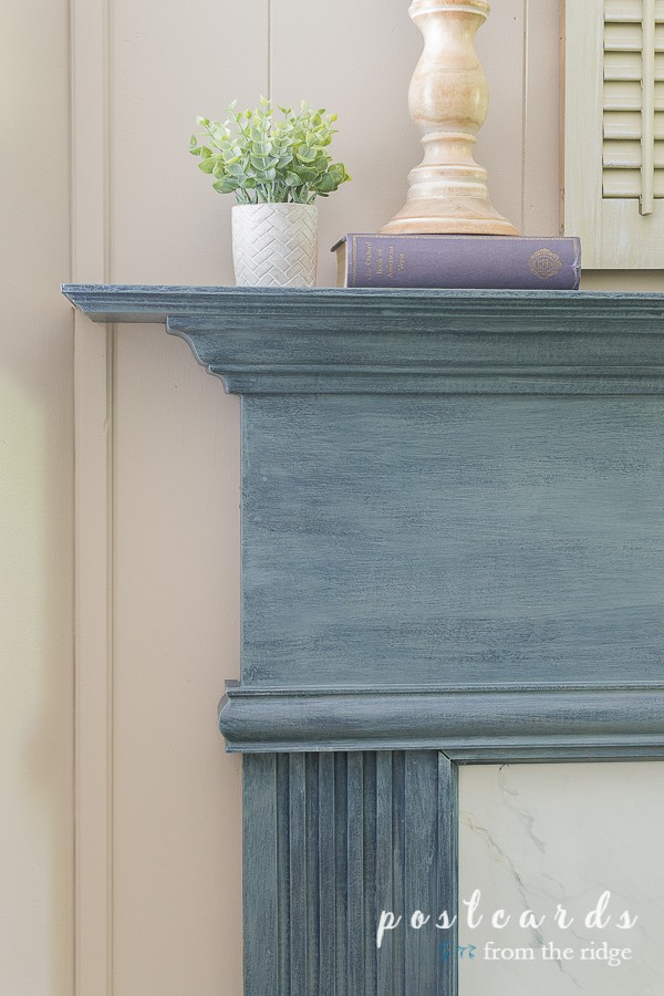 blue painted fireplace mantel