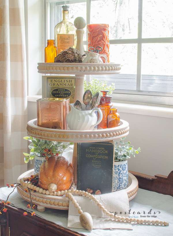wood tiered tray with amber bottles, various fall decor