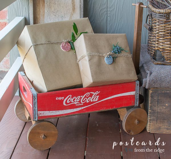 vintage coca cola crate wagon with brown paper packages tied up with string
