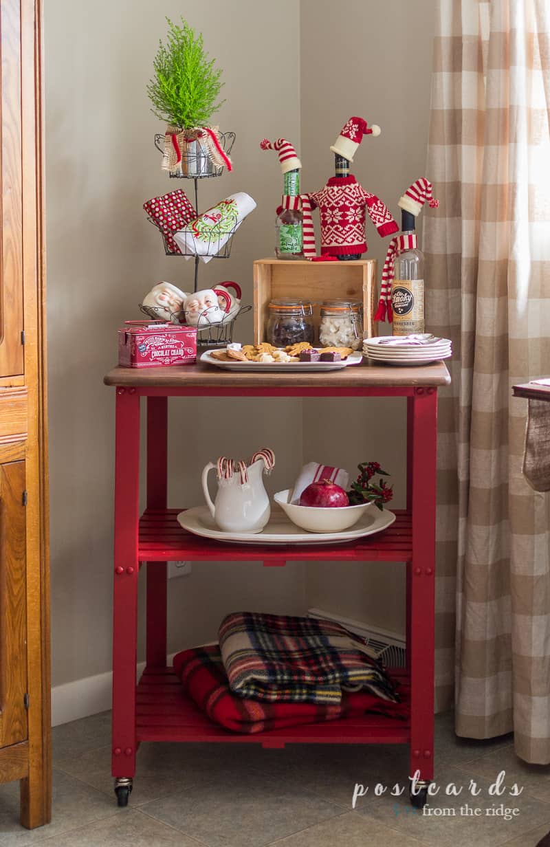 red kitchen cart used for hot cocoa items