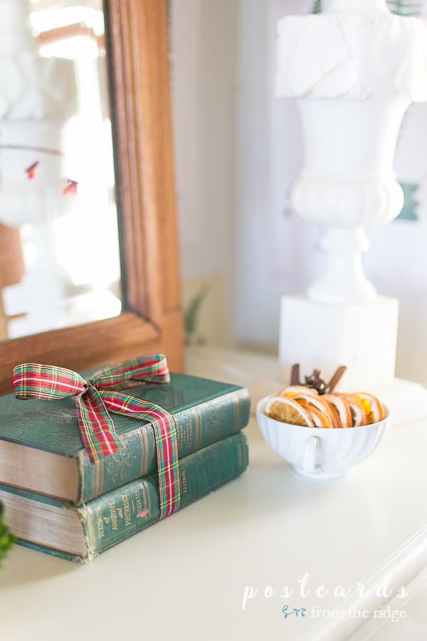 vintage green books with red and green plaid ribbon