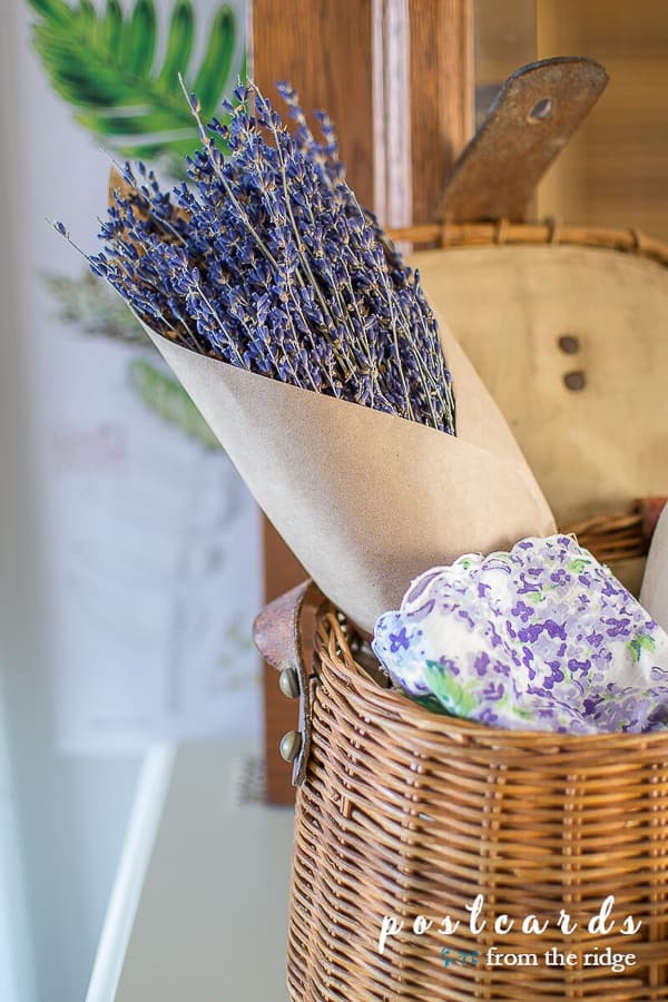 dried French lavender with a vintage handkerchief in a vintage fishing creel