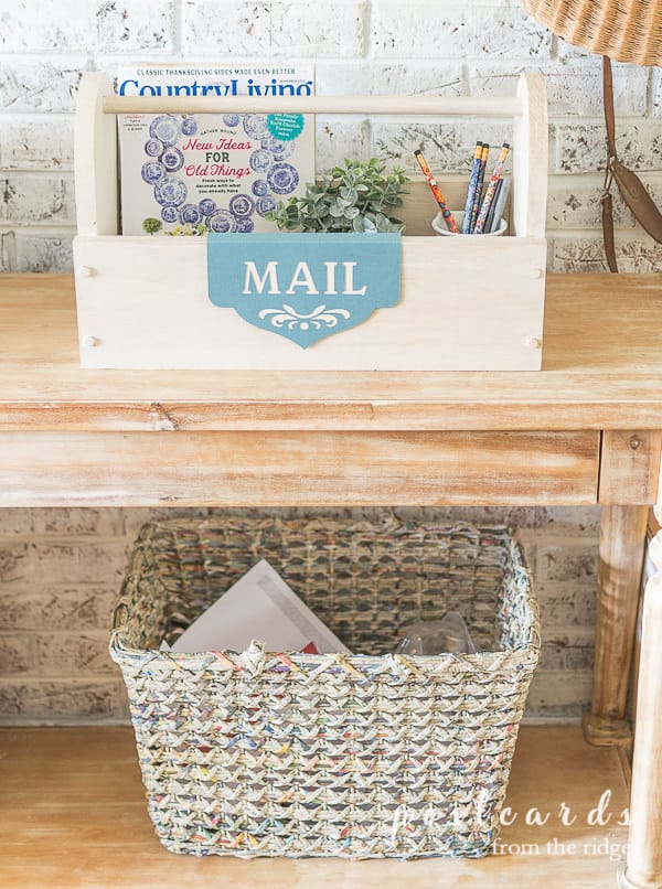 wooden toolbox mail organizer with magazines, pencil, and a label created with cricut