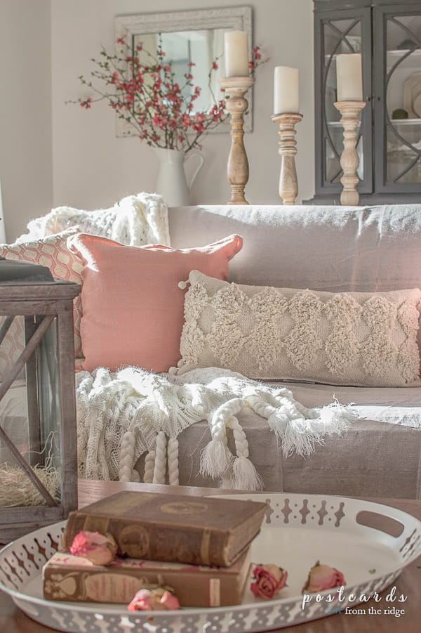 cozy pillows on a slipcovered sofa