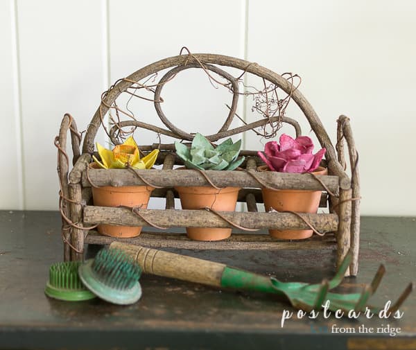 egg carton flowers with vintage garden tools