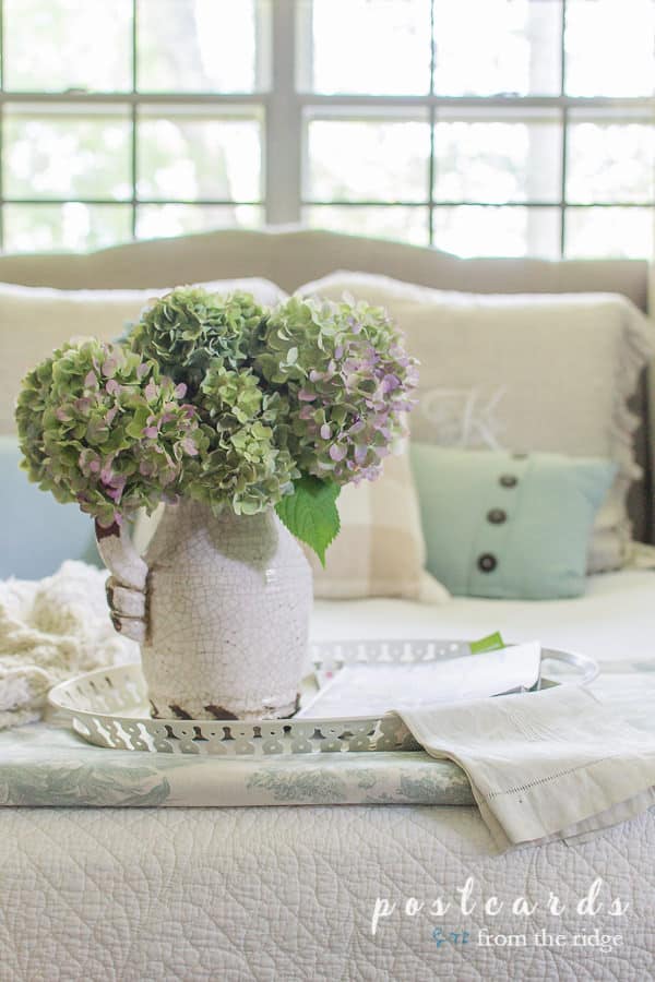 dried hydrangeas on tray with vintage linens