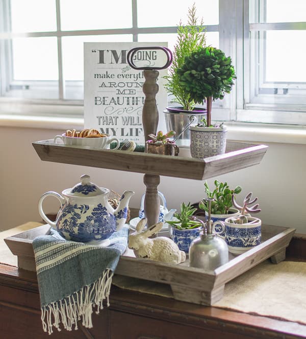 wood tiered tray with blue and white decor
