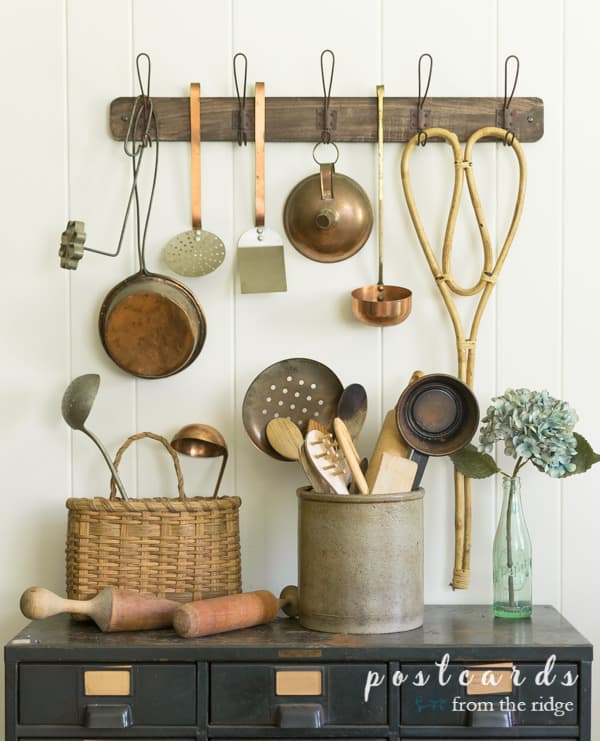 vintage wooden spoons and utensils with vintage cooper kitchen utensils