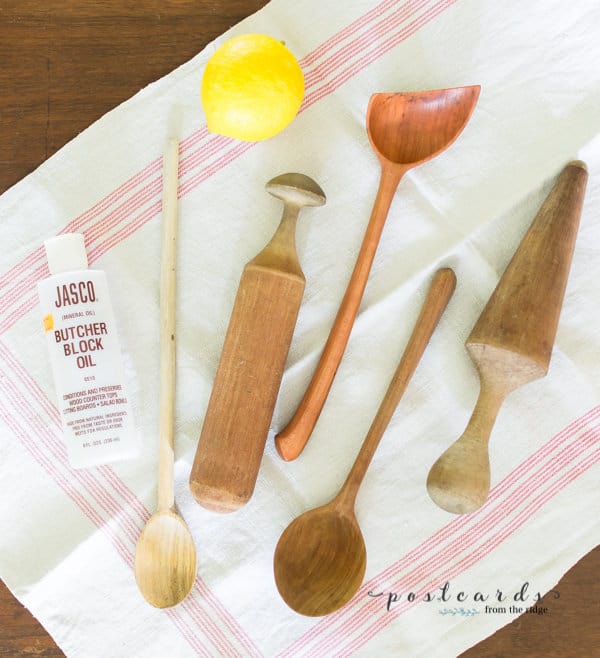 vintage wooden kitchen utensils on vintage kitchen linen