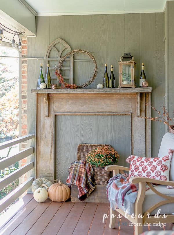 rustic outdoor mantel with pumpkins and fall decor