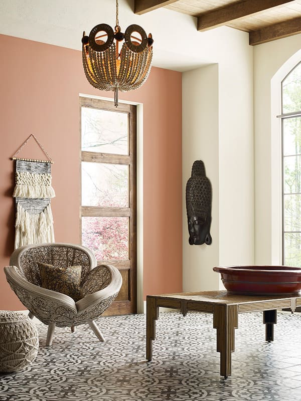 boho living room with accent wall painted with Sherwin Williams Reddened Earth