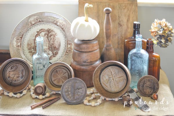 vintage wooden butter molds, glass bottles, dish