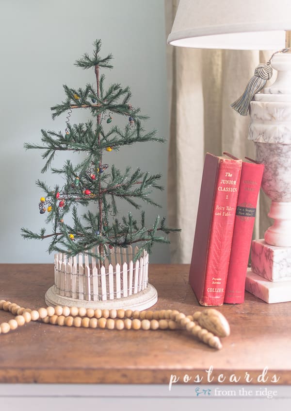 little green feather tree and vintage red books