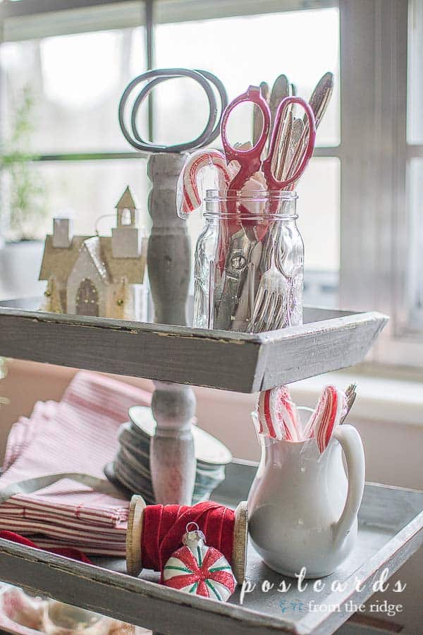 vintage red-handled scissors in a glass jar, red velvet ribbon, white stoneware pitcher
