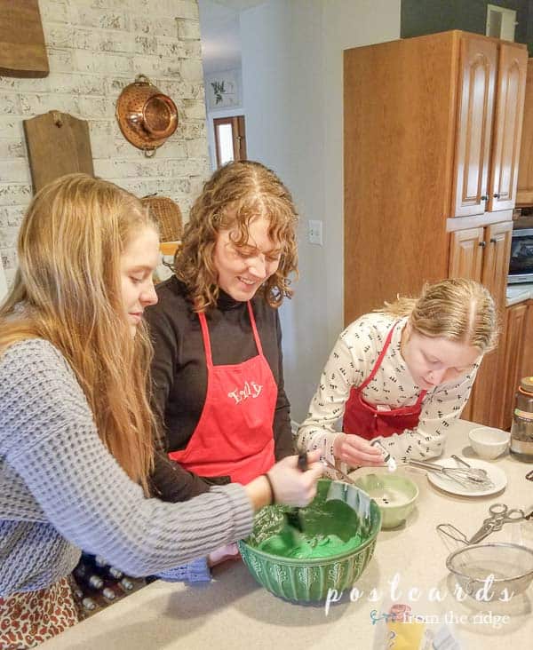 girls baking thumbprint cookies