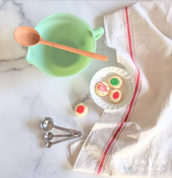 vintage jadeite mixing bowl, measuring spoons, various baking items